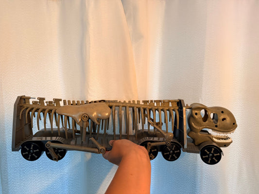 Dinosaur on wheels Dinosaur on wheels rib cage opens for storage Toy Vehicles