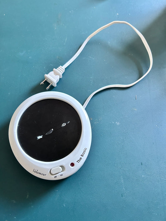 Electronic candle warmer Cord rolls up underneath