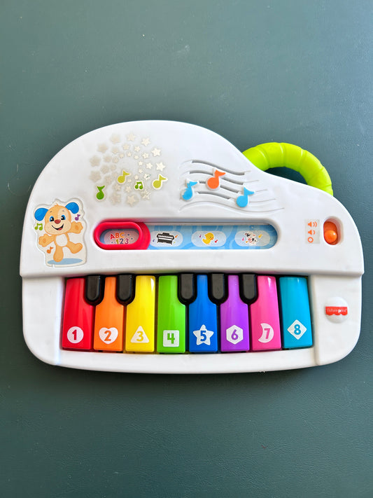 Fisher Price piano - makes regular piano sounds Animal sounds, letters and other music Toddler