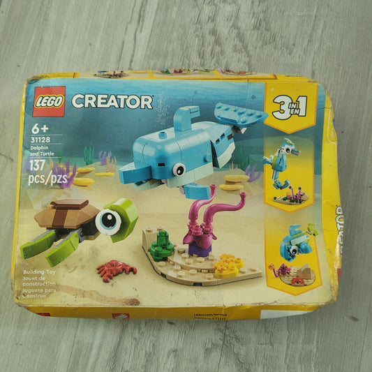 Lego 3 in 1 Dolphin Turtlle Sea Horse Sells for $36. New in box but box has been squished Building