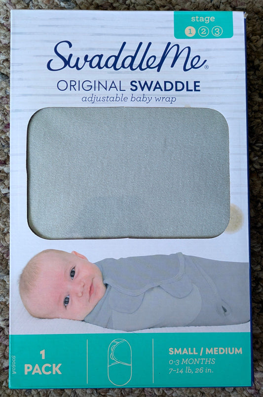 Swaddle me, stain is only on box. Never used Grey swaddle, only opened to confirm no stain on swaddle. Newborn
