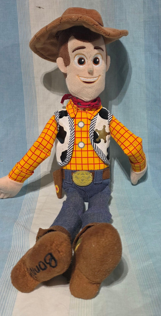 Disney Store Woody plush from Toy Story 4 embroidered eyes and detailed plush sculpting. Plush Toys