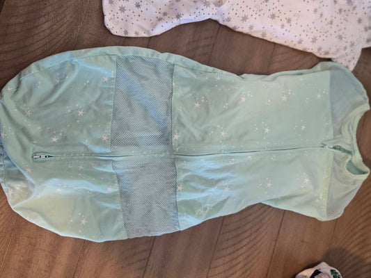 Not sure Large swaddle arms out or in breathable 6 Months
