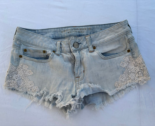 American Eagle GUC light colored denim cut off shorts with lace Women's 8