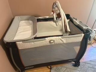 Graco 3 in 1 Bassinet, changing table, side storage, color gray, orange, white Pack-n-Play