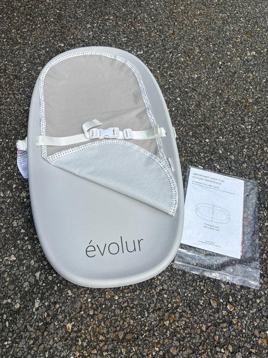 Evolur changing pad, with cloth mat, safety strap Grey, like new, foam/rubber material, portable and washable Potty and Diapering