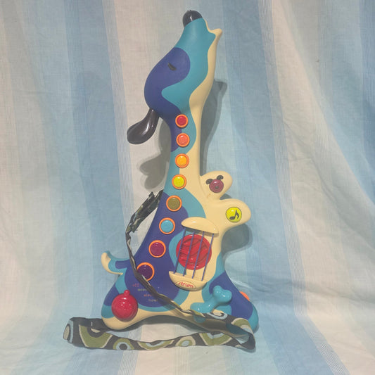 B. Toys Woofer Interactive Dog Guitar. 3 musical modes: acoustic, electric, and hound dog. Pretend Toy