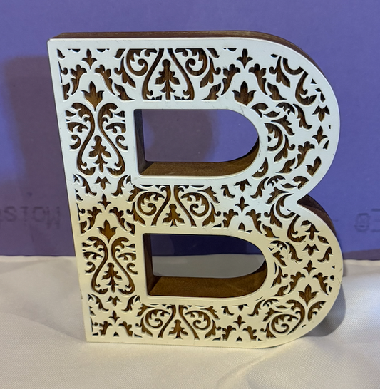 B decor. Can hang on wall. White B. 8 inches tall 6.5 inches wide Wall Hanging